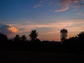 Vibrant sunset view with palm trees silhouetted against a golden sky Royalty Free Stock Photo