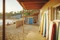 Vibrant surfboards lining a coastal beach shack at sunset Royalty Free Stock Photo