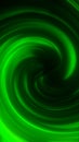 Vibrant swirling green energy vortex forming smooth glowing waves in an abstract dynamic pattern Royalty Free Stock Photo