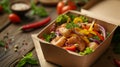 A vibrant takeout box filled with a colorful chicken salad