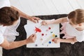 Vibrant talented child and her dad painting together