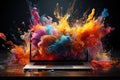 vibrant tapestry of colors and shapes as creativity takes flight from the screen of a laptop, forming a mesmerizing visual