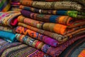 Vibrant textiles A rich stack of colorful patterned fabrics showcasing cultural artistry Royalty Free Stock Photo