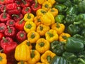 Vibrant Trio of Green, Red, and Yellow Capsicum Peppers