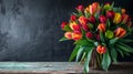 Vibrant Tulip Bouquet on Rustic Wooden Table Against Dark Background Royalty Free Stock Photo