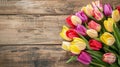 Vibrant Tulips on Wooden Surface: Colorful Springtime Floral Display