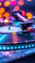 Vibrant turntable playing vinyl record with bokeh lights Royalty Free Stock Photo