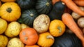 Vibrant vegetables like squash, potatoes, and carrots on display at a stall. Royalty Free Stock Photo