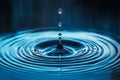 Vibrant Water Drop Impact Creating Symmetrical Ripples and Waves, Abstract Liquid Motion Art Royalty Free Stock Photo