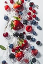 Vibrant water splash with fruits and berries on white background Royalty Free Stock Photo