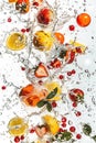 Vibrant water splash with fruits and berries on white background Royalty Free Stock Photo