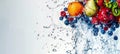 Vibrant water splash with fruits and berries on white background Royalty Free Stock Photo