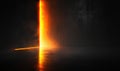 A vibrant wave of orange light illuminates a dark black background Royalty Free Stock Photo