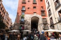 A vibrant weekend morning on the Calle Cava de San Miguel, Madrid, Spain