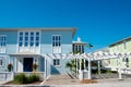 Vibrant white pergola, picket fence front yard curb appeal along scenic 30A country road in Santa Rosa, South Walton Beaches near Royalty Free Stock Photo