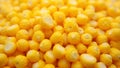 Vibrant yellow corn kernels close up highlighting their glossy texture and rounded forms Royalty Free Stock Photo
