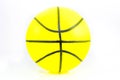 Vibrant yellow plastic toy basketball close up shot Royalty Free Stock Photo