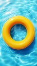 Vibrant yellow pool float peacefully drifting in sparkling blue swimming pool water Royalty Free Stock Photo