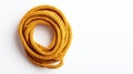 TopDown View of Coiled Yellow Rope on White Background Ideal for Nautical DIY and Texture Mockups Royalty Free Stock Photo