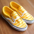 Vibrant Yellow And White Striped Vans Slip-ons For A Stylish Look