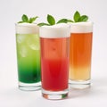 Vibrantly colored cocktails featuring fresh mint leaves on a purewhite backdrop Royalty Free Stock Photo