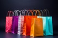 Vibrantly hued shopping bags stand out against a sleek black background Royalty Free Stock Photo