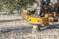 Vibrating machine in an olive tree