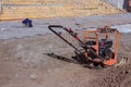 Vibrating plate compactor machine at a construction site. Equipment for soil thrombosis. Compaction work on sand, earth or asphalt Royalty Free Stock Photo