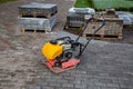 Vibrating plate compactor machine at a construction site. Equipment for soil thrombosis. Compaction work on sand, earth or asphalt Royalty Free Stock Photo