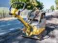 Vibrating plate on a construction site Royalty Free Stock Photo