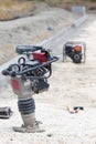 Vibrating plate machine at construction site Royalty Free Stock Photo
