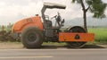 Vibration single-cylinder road roller leveling the ground for the foundation
