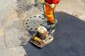 Vibratory plate compactor paving work