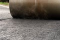 The vibratory roller levels the asphalt pavement Royalty Free Stock Photo