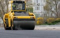 The vibratory roller levels the asphalt pavement Royalty Free Stock Photo