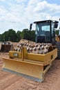 A vibratory rolling machine sits idle