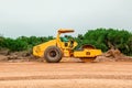 Vibratory soil compactor working on highway construction site. Tandem vibration roller compactor working on highway ground constru