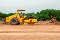 Vibratory soil compactor working on highway construction site. Tandem vibration roller compactor working on highway ground constru