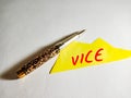 Vice bussiness related text displayed on yellow paper slip writing with pen isolated Royalty Free Stock Photo