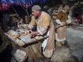 Baker make bread during a historical re-enactment in the caves o