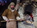 Baker make bread during a historical re-enactment in the caves o