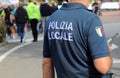 Vicenza, VI, Italy - October 9, 2022: policeman in uniform and text that means LOCAL POLICE in Italian