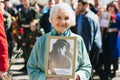 VICHUGA, RUSSIA - MAY 9, 2018: Portrait of a happy smiling old woman at parade in honor of victory in world war II