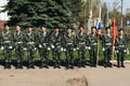 VICHUGA, RUSSIA - MAY 9, 2018: Young men in military uniform with St. George ribbons and flags at parade in honor of the