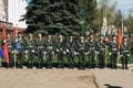 VICHUGA, RUSSIA - MAY 9, 2018: Young men in military uniform with St. George ribbons and flags at parade in honor of the