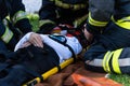 The victim in a car accident lies on a stretcher Royalty Free Stock Photo