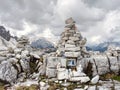 Victim of mountain. Small rock cairn as tombstone in Dolomites