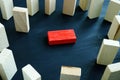 Victimization and discrimination concept. Lying red block and wooden