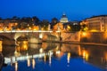 Victor Emmanuel bridge over Tiber river with St. Peter`s Cathedral as background at night, Rome, Italy Royalty Free Stock Photo