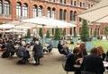 People spending their sunday afternoon in the courtyard at the Victoria and Albert Museum in London